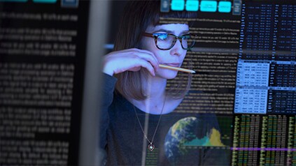 Image of woman performing cybersecurity checks.